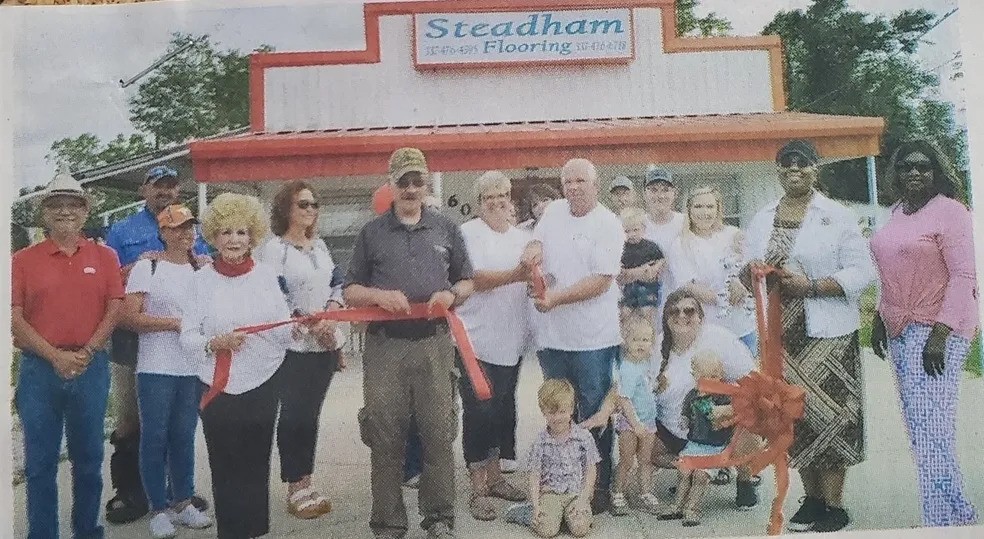 People in front of store | Steadham Flooring LLC